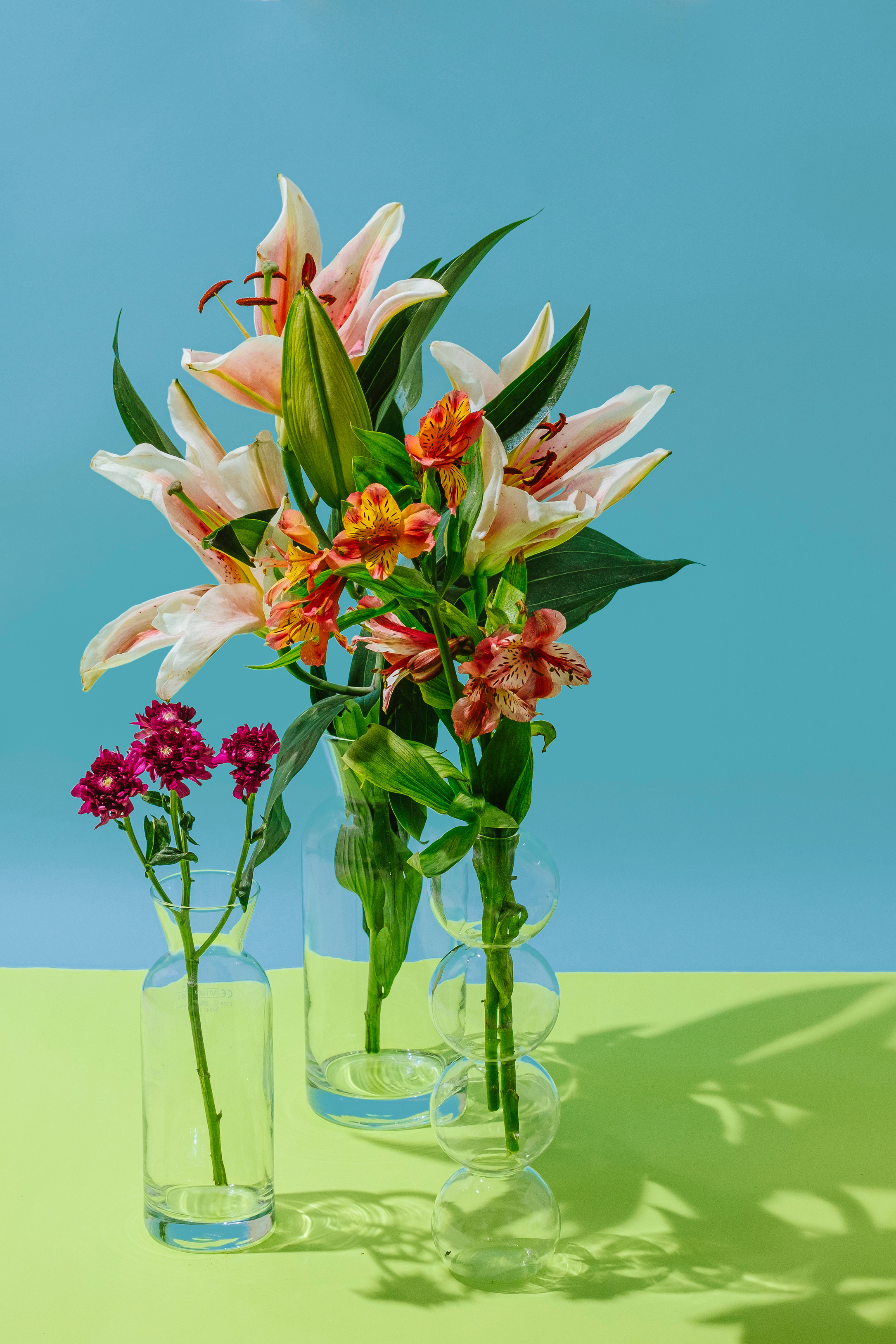 Assorted Flowers in Clear Glass Vases